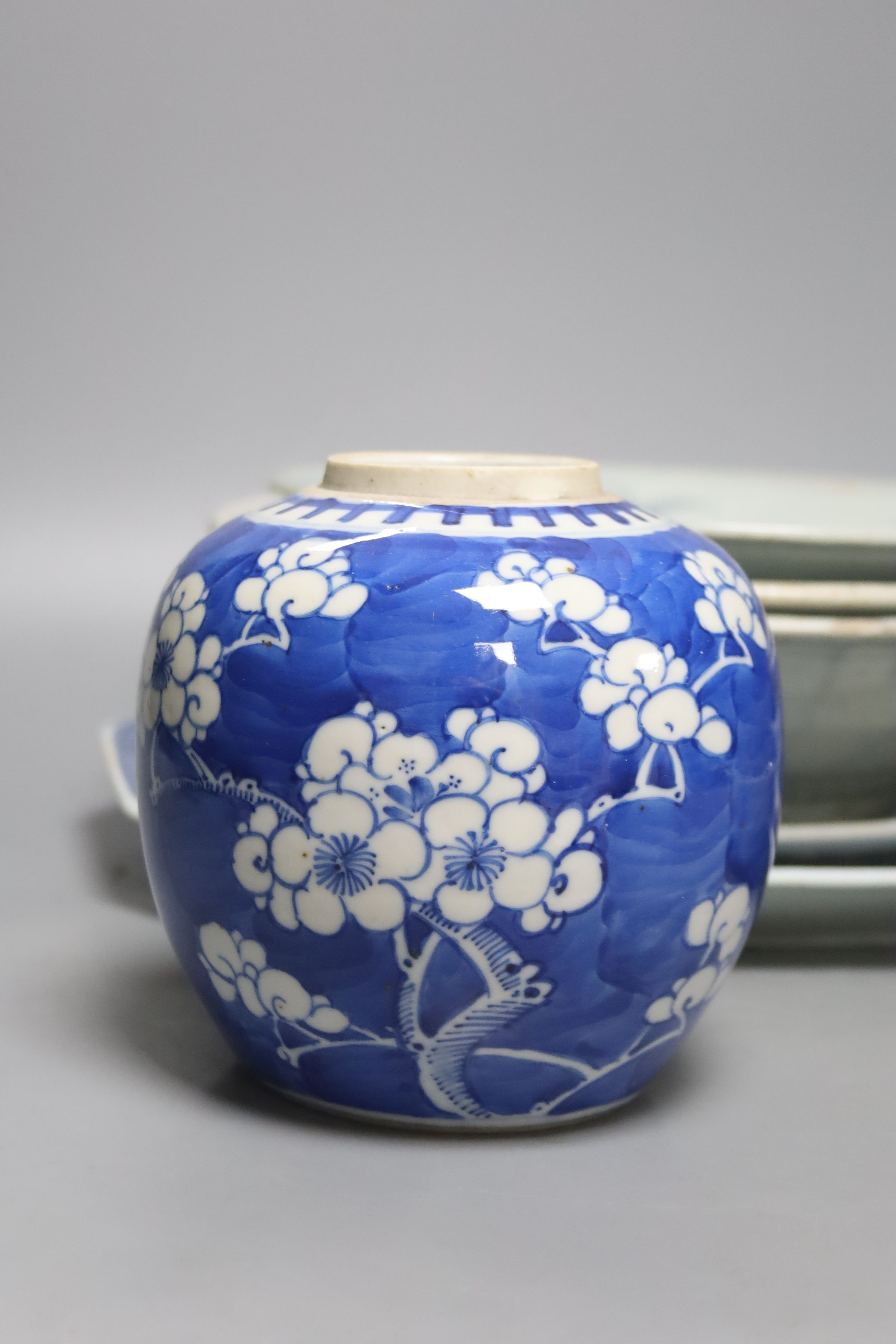 Two 19th century Chinese blue and white dishes and various jars and brush pots, largest item meat platter 33cms wide.